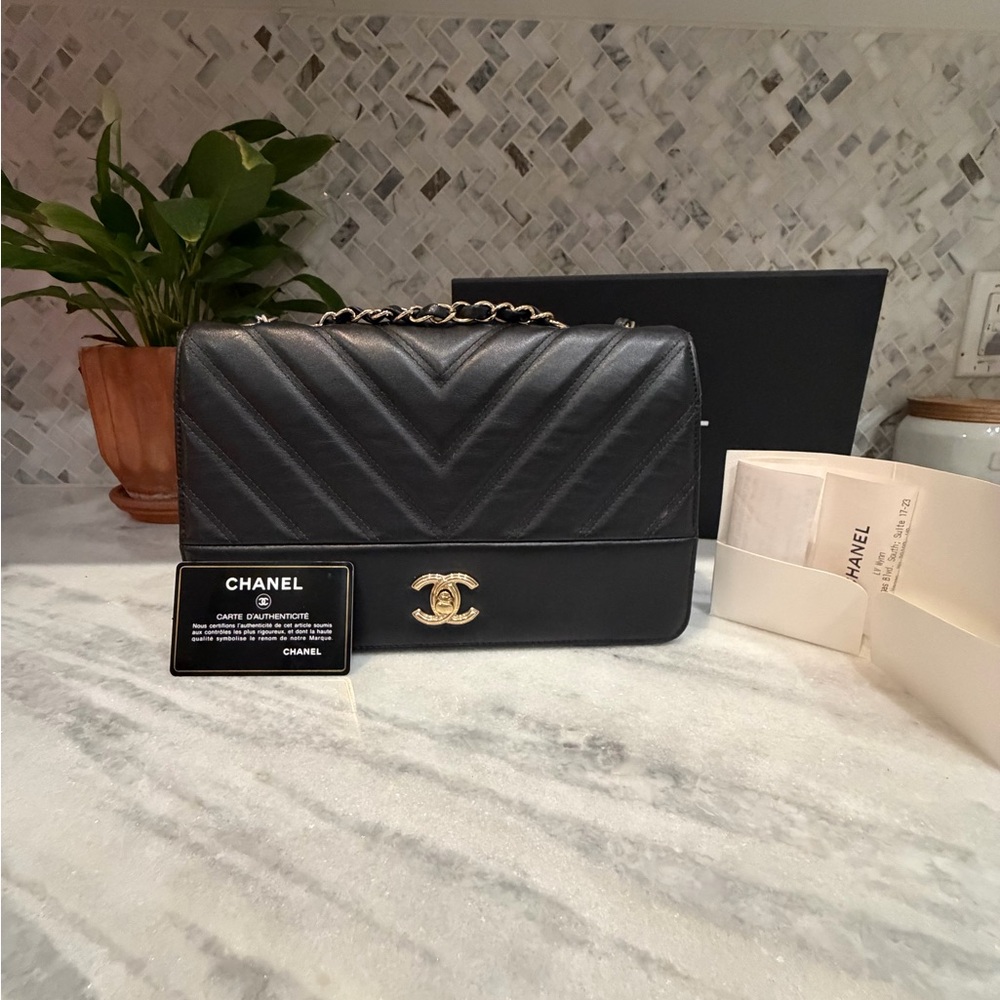 CHANEL Black Chevron Quilted Shoulder Bag with Gold CC Lock